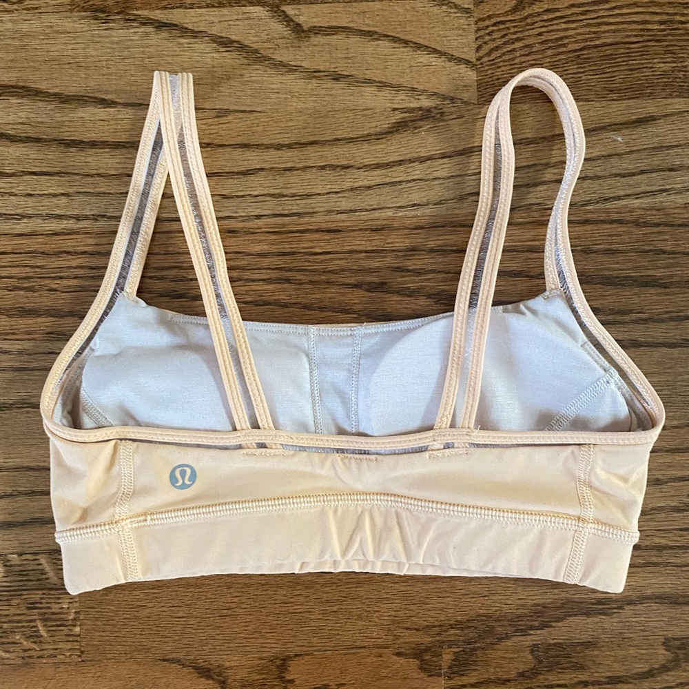 Lulu peach colored sports bra